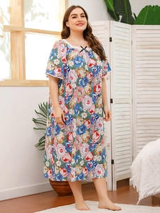 Detail of floral print nightdress featuring delicate lace trim and a small bow on the neckline