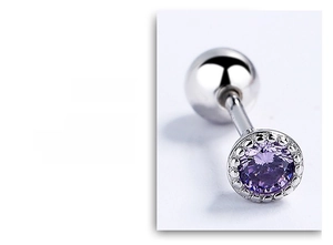 Macro detail of screw back stud earring featuring round purple zircon and beaded metal bezel