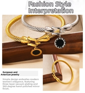 Detail of twisted cable bracelet with 18k gold plating and Roman numeral charm