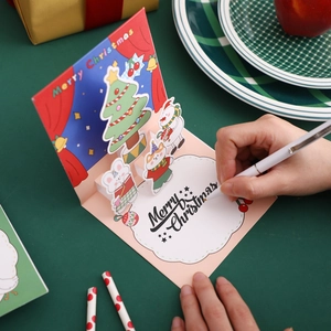 3D Pop-up Christmas card with tree and snowman elements, featuring Merry Christmas gold foil