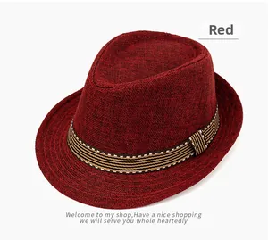 Detail of red linen fedora hat featuring a striped band with breathable woven texture