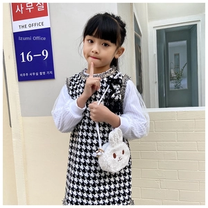 Detail of cute white plush rabbit crossbody bag accessory for little girls