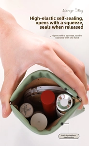 Detail of squeezing mechanism on green PU leather storage bag with stainless steel spring