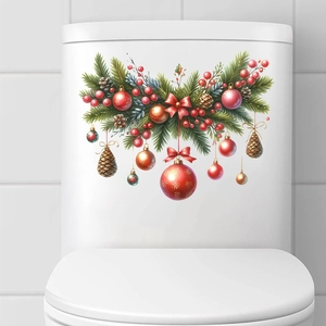 Close-up of Christmas pine branch and red bauble decals on a white bathroom toilet tank
