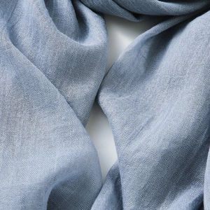 Soft blue cotton linen scarf with a lightweight breathable texture for sun protection