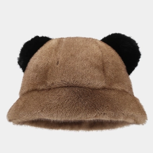 Close-up of brown faux fur bucket hat with cute black plush animal ears on top