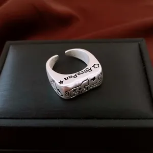 Vintage silver horse ring with star relief and Recopan engraving in punk style