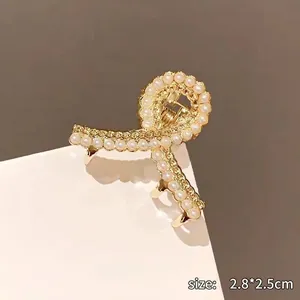 Elegante pinza per capelli dorata con perle a forma di fiocco, circa 2,8 x 2,5 cm
