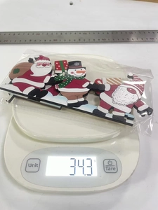 Detailed view of lightweight wooden Christmas door frame ornaments with ruler and scale