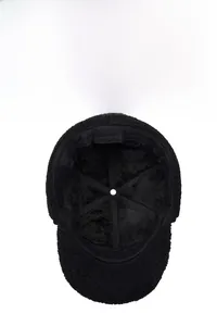 Detailed view of the thick black lamb wool lining inside this warm winter earflap hat