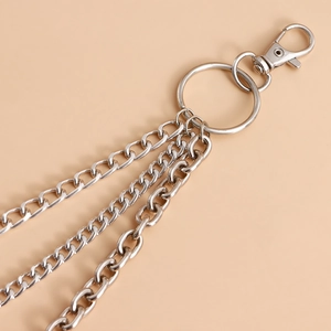 Detail shot of multi-layer silver metal waist chain with heart cutout and lobster clasp