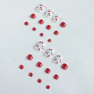 Red and white cherry pattern press-on toenails set featuring 24 pieces of resin nails