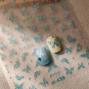 Autocollants ongles papillon 3D holographiques avec textures en relief et fini laser chic