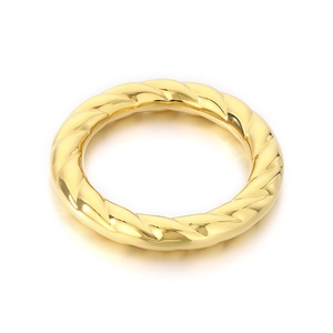 Exaggerated polished spiral gold bangle in 18k plated stainless steel with high shine