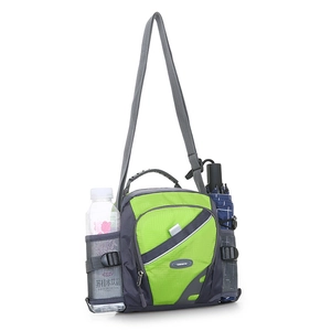 Detail view of fluorescent green nylon crossbody bag with dual mesh water bottle pockets