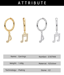Macro detail of music note earrings in silver and gold with CZ zircon inlay on 925 silver