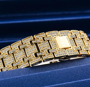 Close-up of hip hop gold bracelet with pavé cubic zirconia in a blue jewelry box