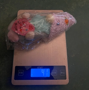 Weight measurement of plush heart gnome doll showing 41g on electronic scale