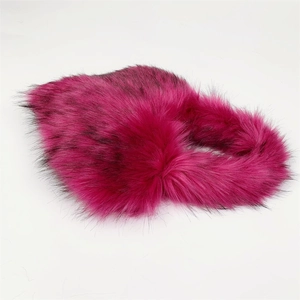 Close-up of rose red faux fur texture with black tips on heart-shaped shell bag