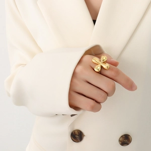 French retro gold-plated titanium steel floral ring for women shown on a model index finger