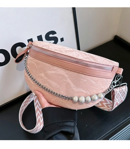 Detail of pink marble pattern bag with pearl chain and geometric wave wide strap