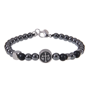 Detailed macro view of men's beaded bracelet with cross charm and matte black stones