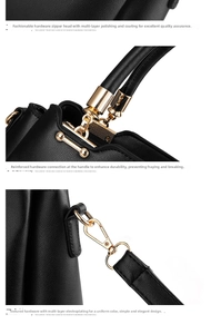 Detailed close-up of premium black leather texture and gold hardware on handbag