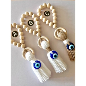 Bohemian wood bead door hangers with tassels and blue evil eye glass charms