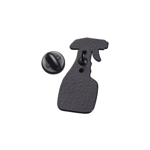 Rear view of spray bottle metal brooch with matte black finish and rubber clutch pin