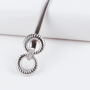 Detail of silver elastic metal waist chain featuring textured interlocking round rings
