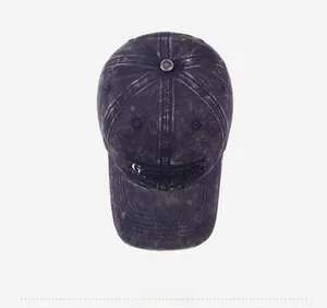 Detailed top view of vintage navy washed cotton baseball cap with GUHHA embroidery