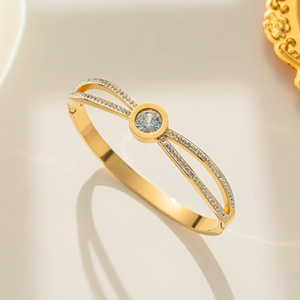 Rose gold titanium steel Roman numeral bangle with double rows of sparkling cubic zirconia