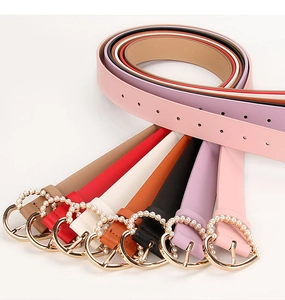 Variety of colorful women's belts with elegant heart-shaped pearl buckles in multiple shades