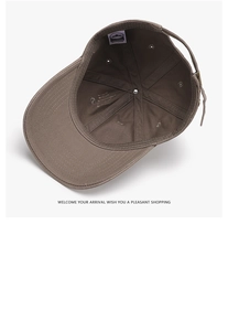 Detail of adjustable metal buckle and inner cotton lining on dark brown baseball cap