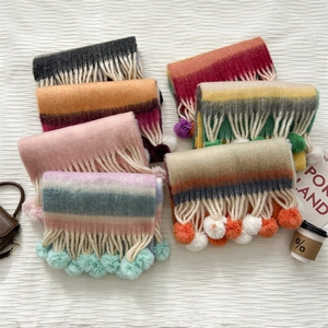 Rainbow striped mohair scarf with pompoms and white tassels for winter warmth