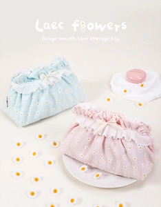Detailed view of floral lace drawstring cosmetic bags in light blue and pink pastel colors