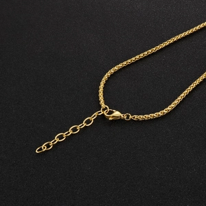 Close-up of golden titanium steel lobster clasp and extension chain on the necklace