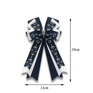 Navy blue equestrian bow hair clip with gold bit pattern and crystal centerpiece