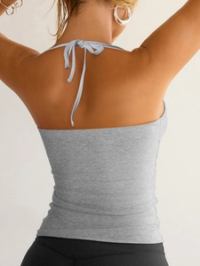 Detailed back view of grey ribbed knit halter top featuring an open back and neck ties