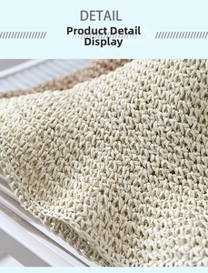 Macro shot of natural straw hat texture showing the tight weave and fiber detail