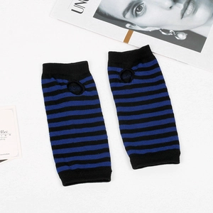 Detail of blue and black striped knitted fingerless arm sleeves with thumb hole