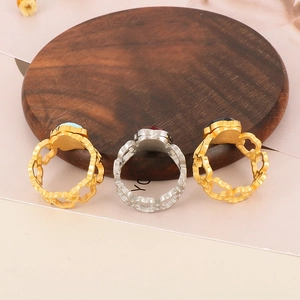 Three-piece set of hollow floral rings with blue, red, and black gemstones in gold finish