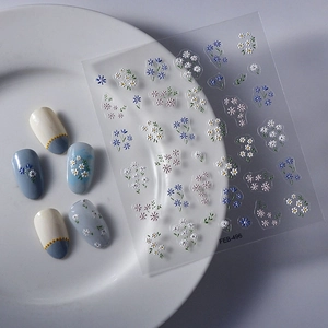 Detail of floral nail art stickers FEB-496 with 3D daisies and blue blossom decals