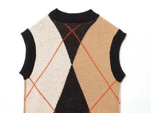 Detailed view of diamond pattern knit vest with orange contrast stitching and ribbed neckline