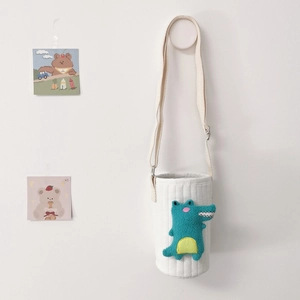 Quilted white fabric water bottle sleeve featuring a cute green 3D dinosaur with strap