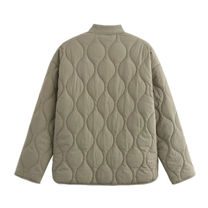 Detailed back view of olive green quilted jacket featuring wave stitching and ribbed collar