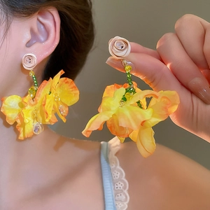 Floral tassel earrings featuring orange gradient petals and beige rose bud stud
