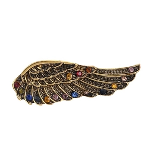 Vintage wing-shaped brooch in antique gold metal with multi-color rhinestones