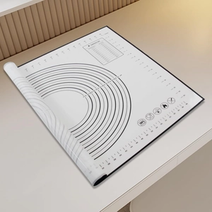 Macro shot of silicone baking mat featuring measurement scales and temperature conversion chart