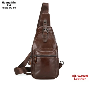 Detail view of brown oil wax leather sling bag showing zipper pocket and metal buckle